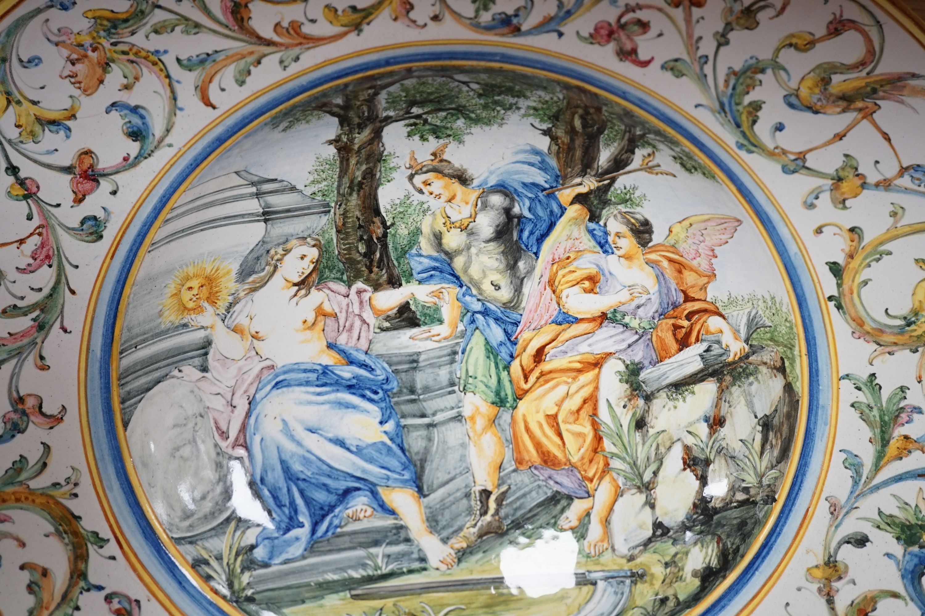 A 19th century large Italian majolica charger, AVF mark, 55cm high.